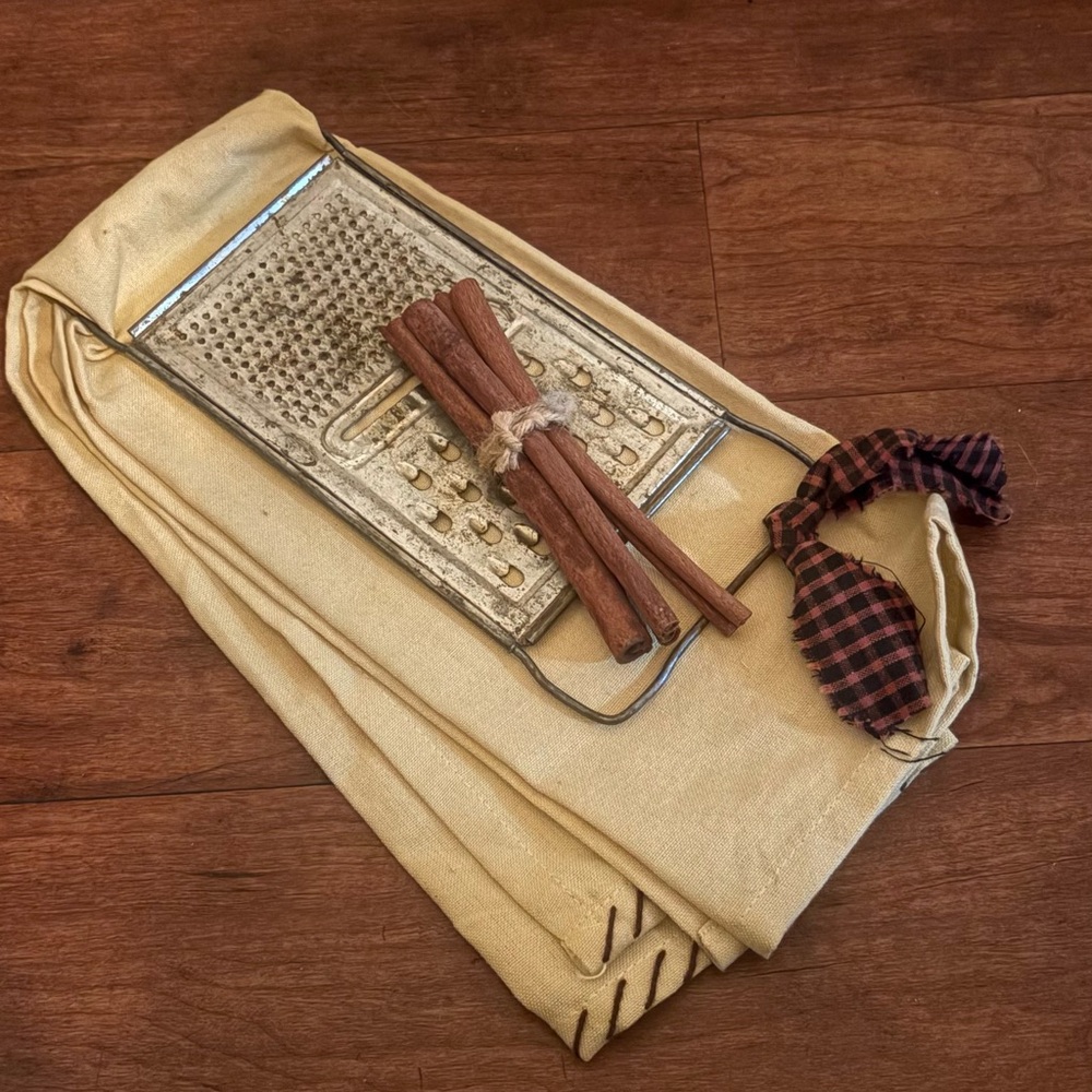 Vintage Grater with Cinnamon Sticks and Cloth